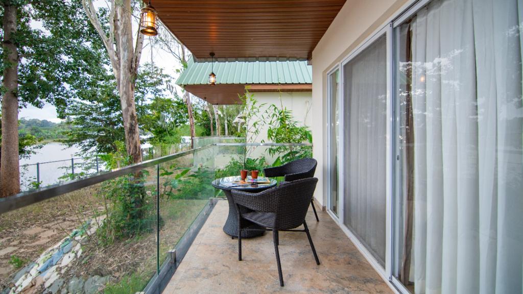 Private balcony overlooking Kali River at Dandeli resort