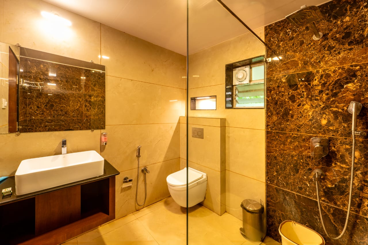 Modern bathroom in river cottage with rain shower